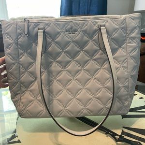 Great Kate Spade tote! It’s a pretty off-white blueish/grey.